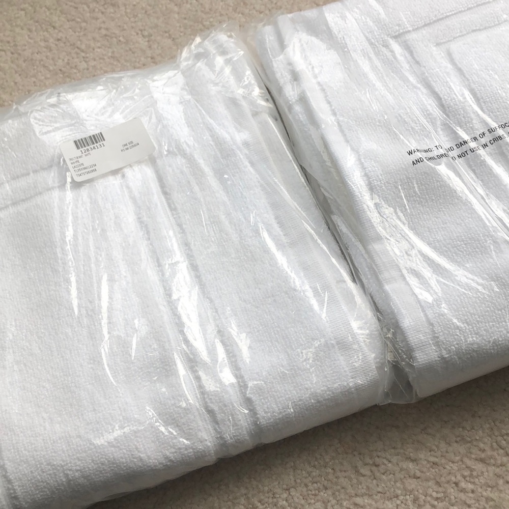 Brand new LACOSTE bath mats